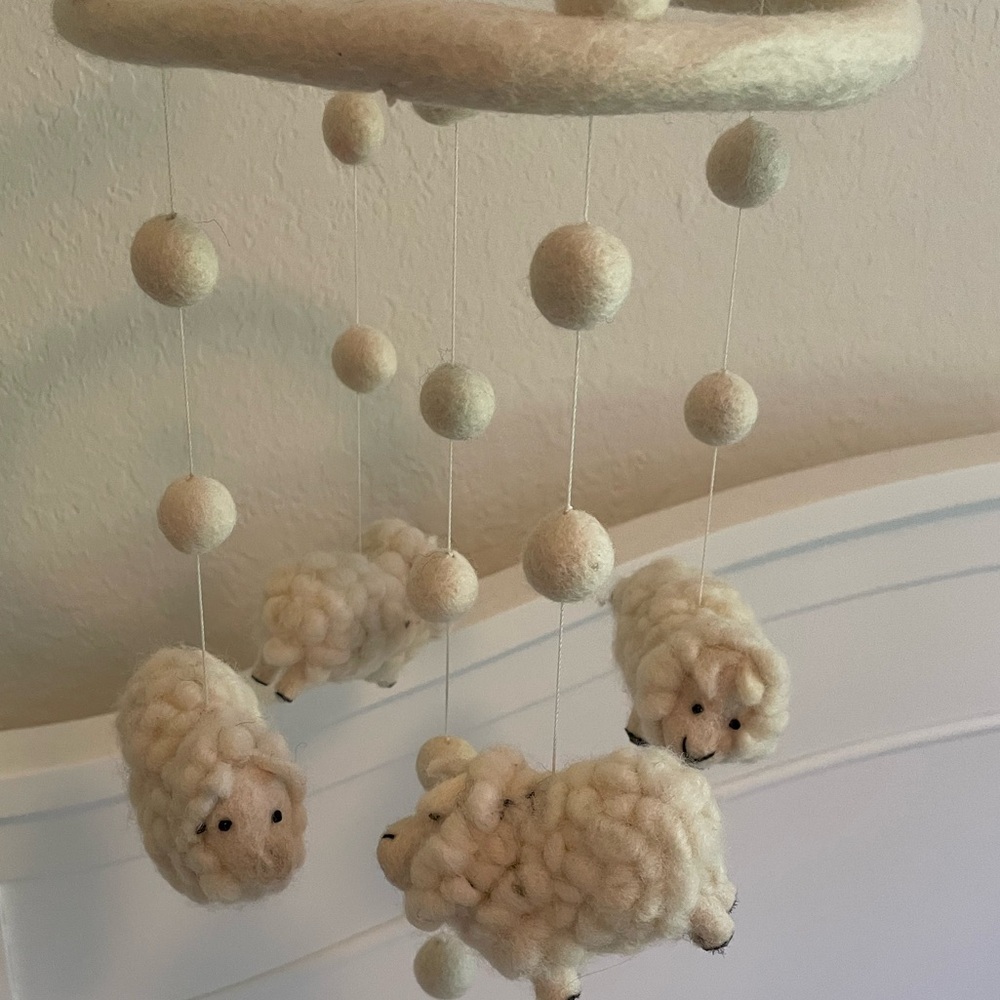 Lamb Mobile with mobile wood holder